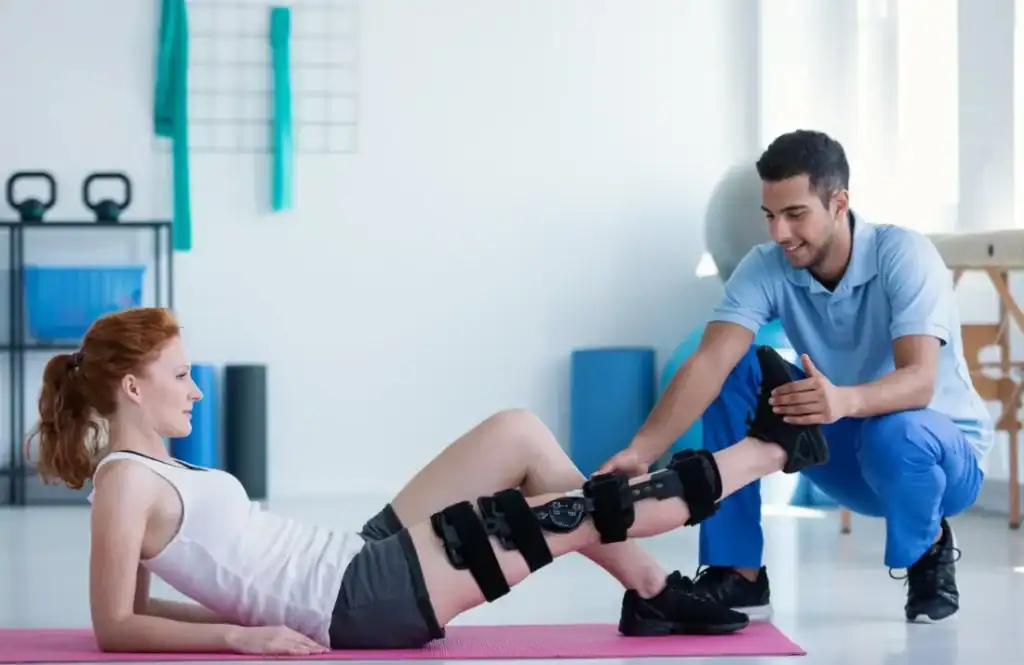 Woman having treatment to help muscle recovery Calne after an injury